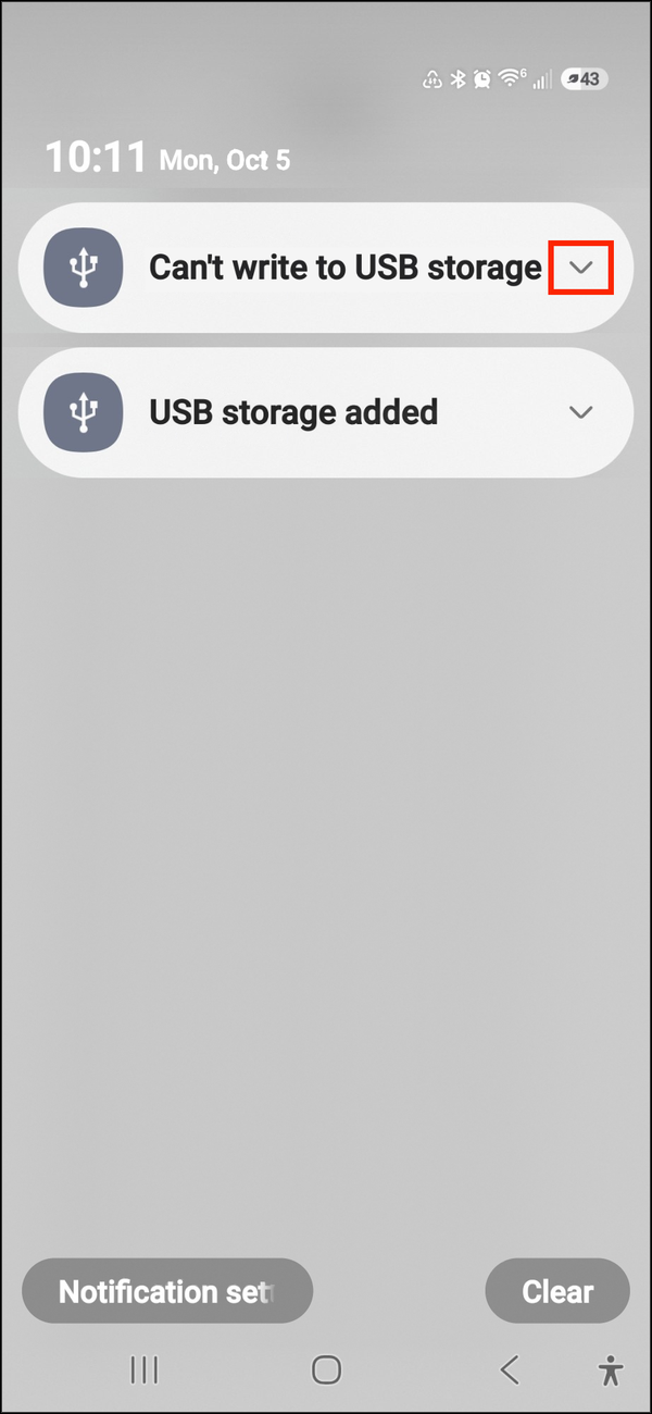 Samsung notification shade with Can't write to USB storage collapsed, its arrow highlighted